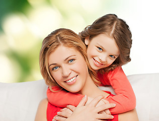 Image showing happy mother with daughter hugging and talking