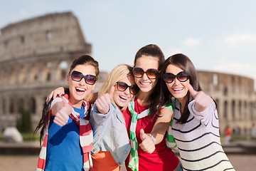 Image showing happy teenage girls or women showing thumbs up