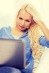 Image showing woman with laptop computer at home