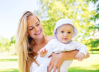 Image showing happy mother with little baby in park