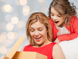 Image showing happy mother and daughter opening gift box