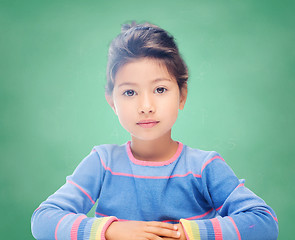 Image showing little girl over chalk board background at school