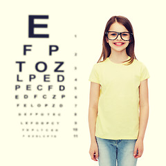 Image showing smiling cute little girl in black eyeglasses