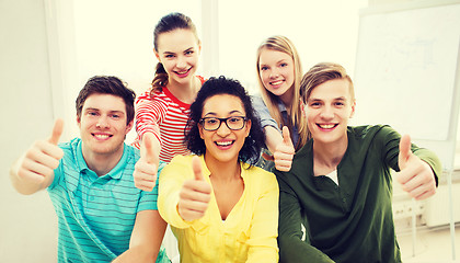 Image showing smiling students at school showing thumbs up