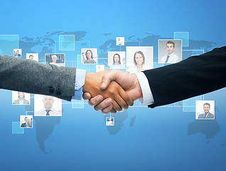 Image showing businessman and businesswoman shaking hands