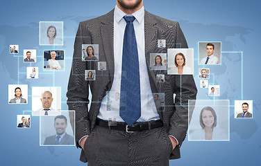 Image showing close up of businessman over icons with contacts