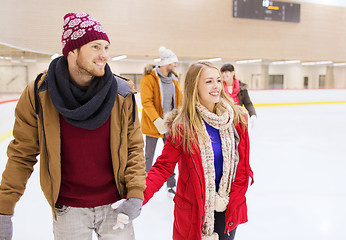 Image showing happy friends on skating rink