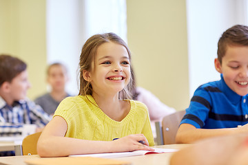 Image showing group of school kids writing test in classroom