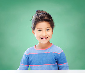 Image showing little girl over chalk board background at school