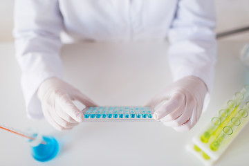 Image showing close up of scientist making test in lab