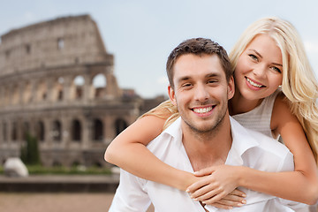 Image showing happy couple hugging over coliseum