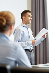 Image showing smiling businesspeople meeting in office