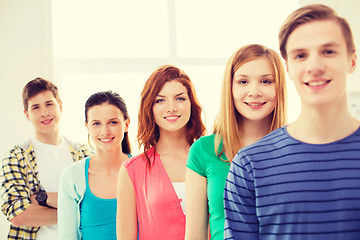 Image showing smiling male student with group of classmates