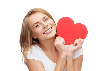 Image showing smiling woman in white t-shirt with heart