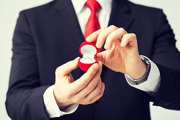 Image showing man with wedding ring and gift box