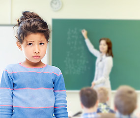 Image showing sad little school girl