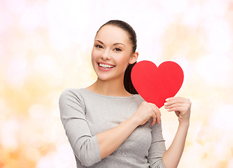 Image showing smiling asian woman with red heart