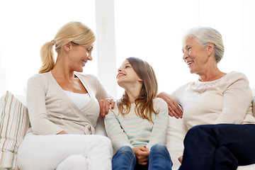 Image showing smiling family at home