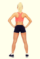 Image showing athletic woman in sportswear from the back