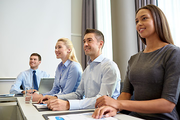 Image showing smiling business people meeting in office