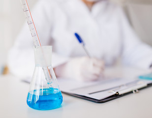 Image showing close up of scientist making test in laboratory