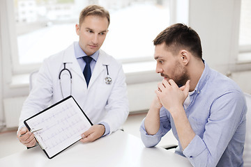 Image showing doctor with clipboard and patient in hospital