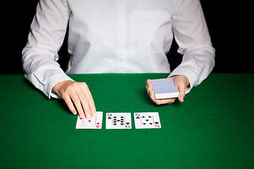 Image showing holdem dealer with playing cards