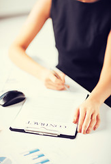 Image showing woman hand signing contract paper