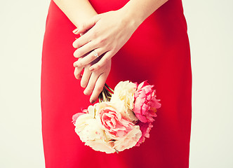 Image showing woman hands with flowers and ring