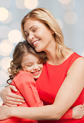 Image showing happy mother and daughter hugging