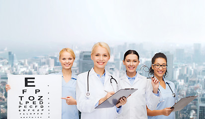 Image showing smiling female eye doctors and nurses