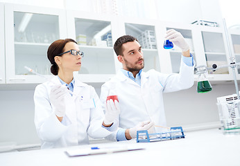 Image showing young scientists making test or research in lab