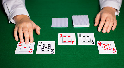 Image showing holdem dealer with playing cards