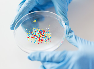 Image showing close up of scientist hands holding chemical cure