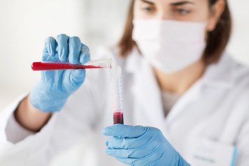 Image showing close up of scientist with tube making test in lab