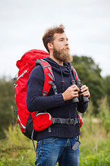 Image showing man with backpack and binocular outdoors