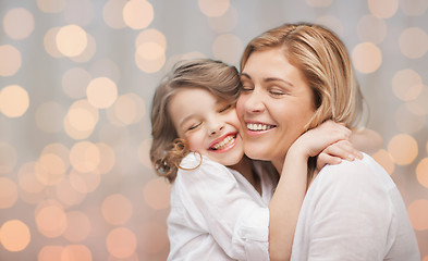 Image showing happy mother and daughter hugging