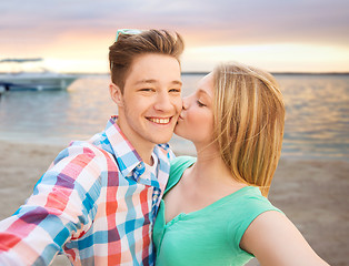 Image showing happy couple taking selfie on summer beach