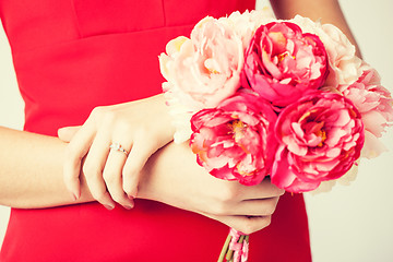 Image showing woman hands with flowers and ring