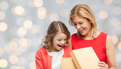 Image showing happy mother and daughter opening gift box