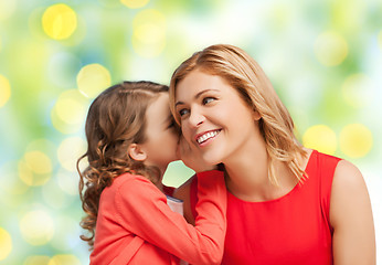 Image showing happy daughter whispering gossip to her mother