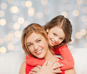 Image showing happy mother with daughter hugging and talking