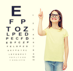 Image showing smiling cute little girl in black eyeglasses