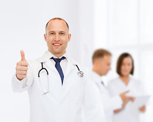 Image showing smiling male doctor with stethoscope