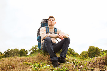 Image showing man with backpack hiking