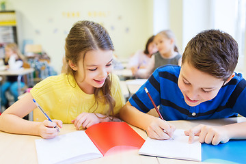 Image showing group of school kids writing test in classroom