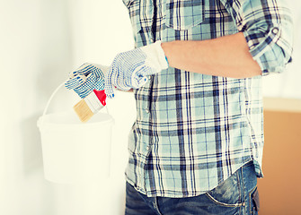 Image showing man with paintbrush and pot