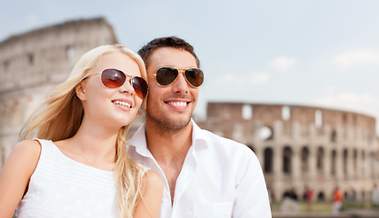 Image showing happy couple hugging over coliseum