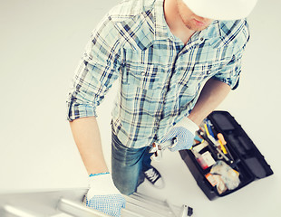 Image showing man with ladder, toolkit and spanner