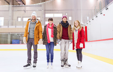 Image showing happy friends on skating rink